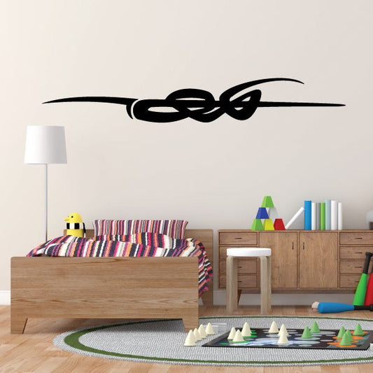 Black vehicle pinstripe decal with ornate knot design, wall sticker