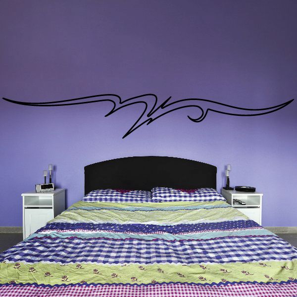 Black pinstripe vinyl wall decal with scroll swirls above bed headboard