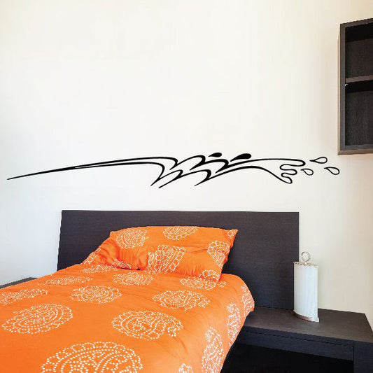 Vehicle pinstripe vinyl decal with black flame-like swirl graphic, wall decal