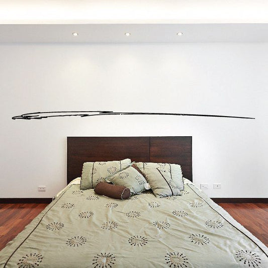 Vehicle pinstripe vinyl decal, long black swoosh stripe on wall above bed