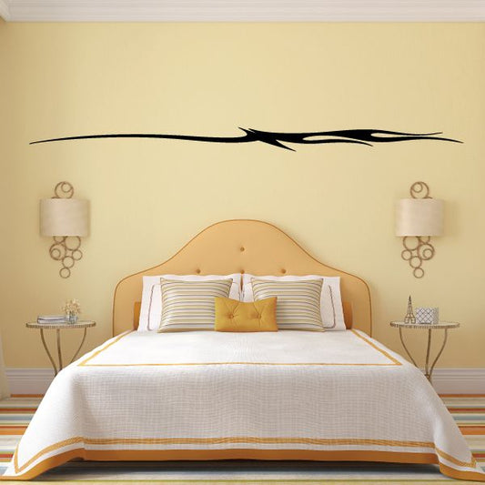 Black vehicle pinstripe vinyl decal with winged stripe design above bed