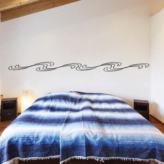 Pinstripe vinyl wall decal with black swirl lines along a horizontal border