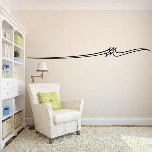 Vehicle pinstripe vinyl decal with long black swoosh line and small starburst accent