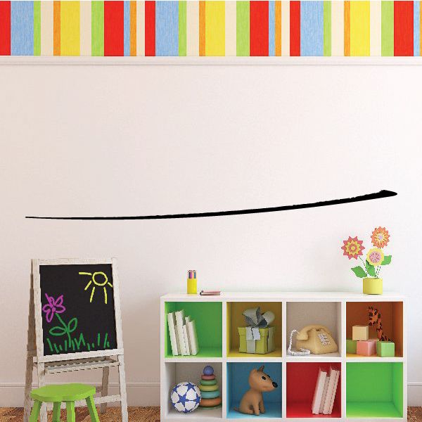 Vinyl pinstripe decal with a thin black curved stripe on a wall