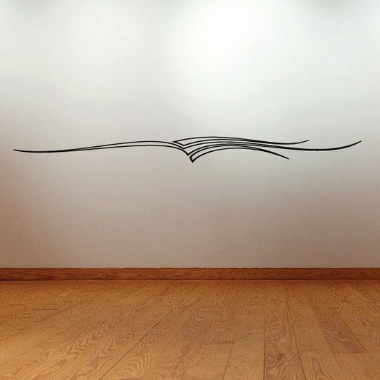Pinstripe vinyl vehicle decal with black sweeping line and central wing motif
