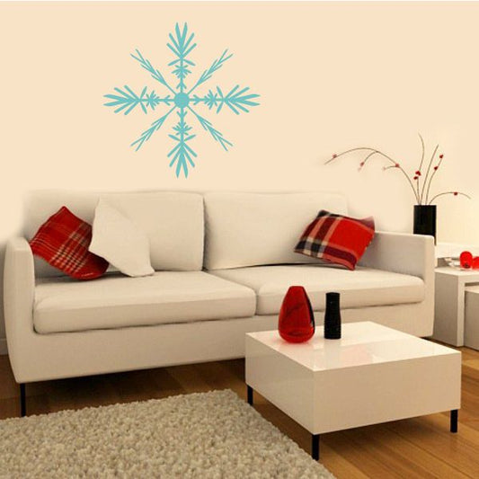 Light blue snowflake wall decal with layered arms and center dot