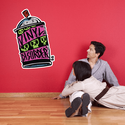 Decorative wall sticker adhered to a living room wall