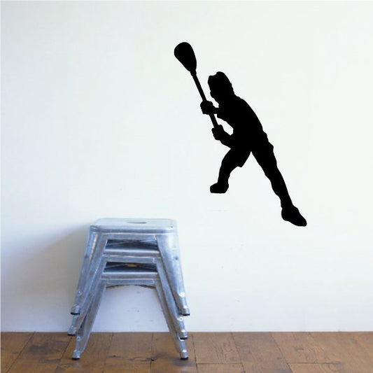 Black lacrosse player decal silhouette with raised stick