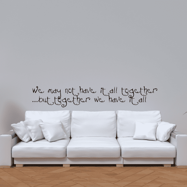 Wall quote decal with handwritten text on a light wall