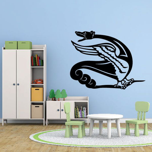 Black winged serpent wall decal with curled tail and detailed wings