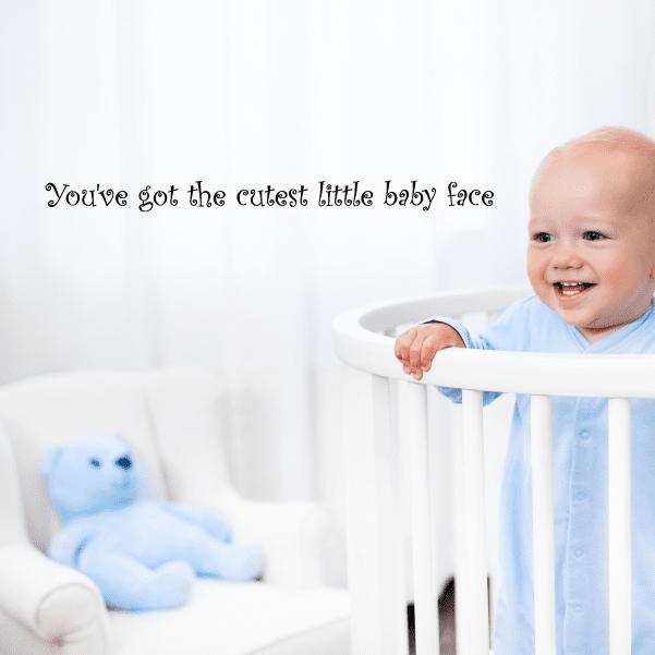 Cursive wall decal text: "You've got the cutest little baby face"