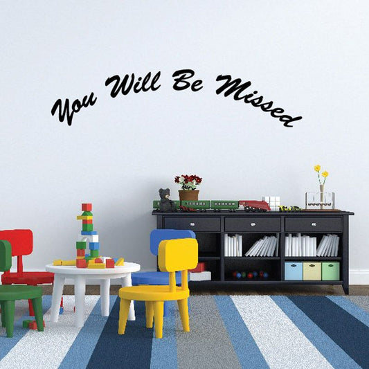 Wall decal with “You Will Be Missed” script lettering
