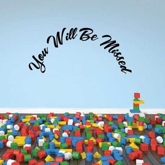 Vinyl wall decal with black cursive “You Will Be Missed In Loving Memory”