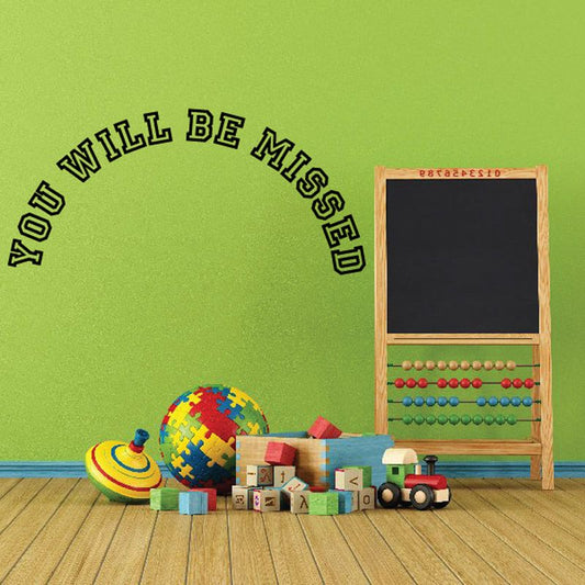 Memorial vinyl wall decal with curved text: 'You Will Be Missed'.