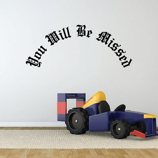 Memorial wall decal with arched text: 'You Will Be Missed'.