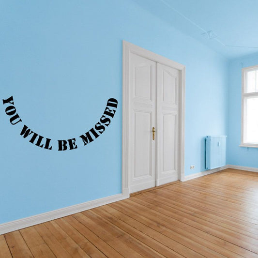 Memorial wall vinyl decal with black text: 'You Will Be Missed in Loving Memory'.