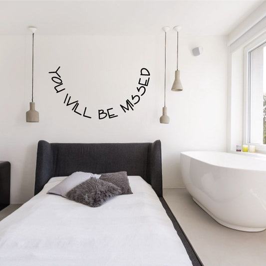Wall decal with black script text reading “YOU WILL BE MISSED”.