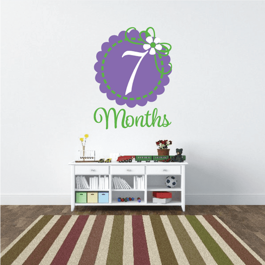 Purple 7 Months wall decal with green vine and white flower
