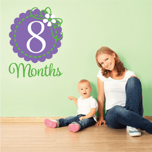 8-month wall decal with purple number 8, green months script, and white flower accent