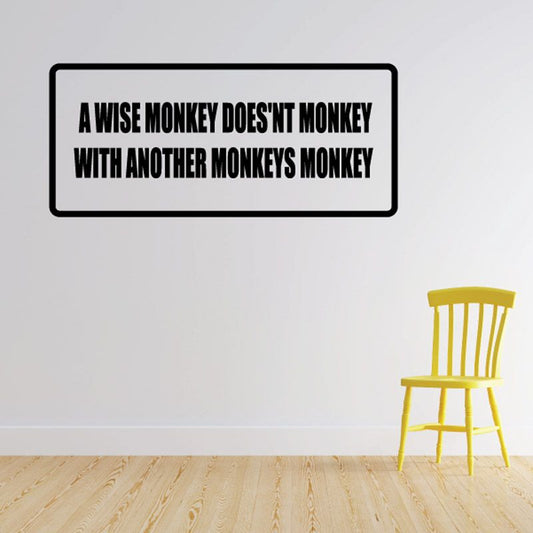 Rectangular wall decal with black border and bold monkey quote text
