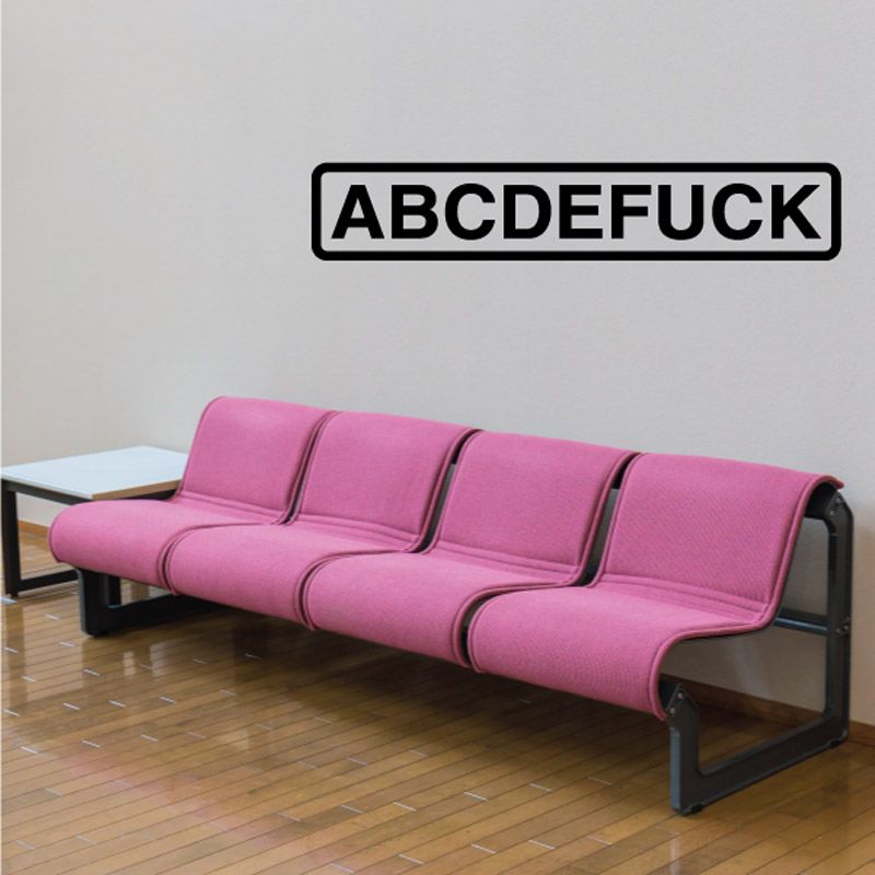 Pink sofa bed with three cushioned sections and dark armrests