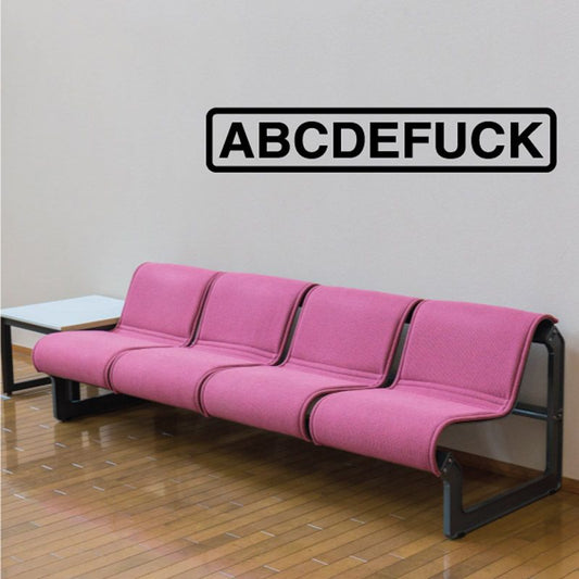 Pink sofa bed with three cushioned sections and dark armrests