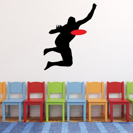 Frisbee grab decal with black silhouette and red flying disc