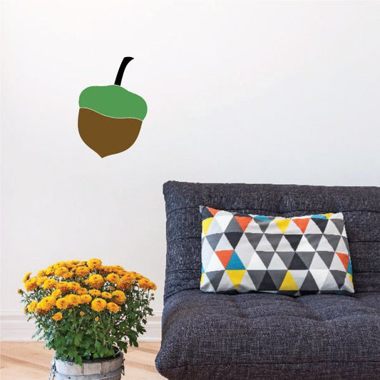 Acorn sticker with green cap and brown acorn body, simple flat graphic