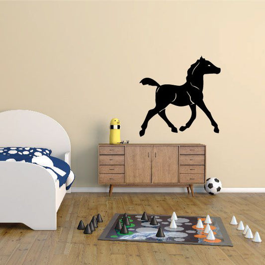 Black walking pony wall decal, side profile with raised tail and legs