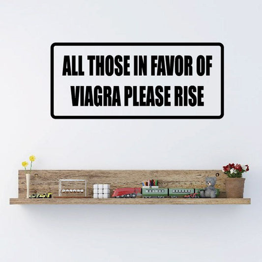 White wall decal with bold black quote: 'All those in favor of viagra please rise'