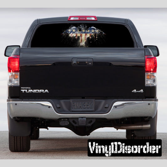 Pickup truck rear window graphic through rear window on dark rear end view