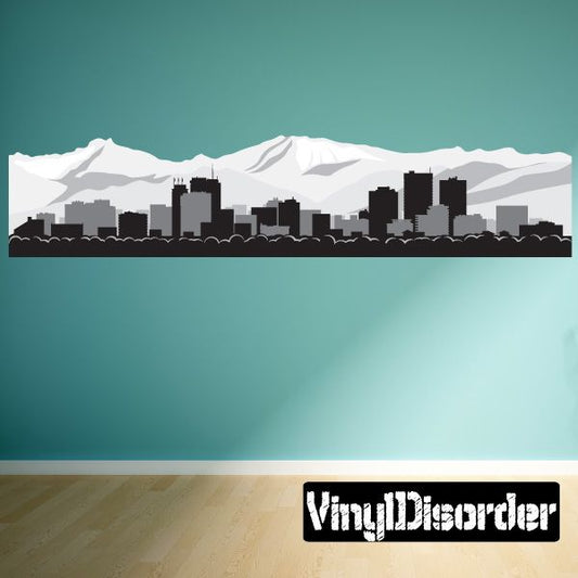 Anchorage skyline vinyl wall decal with snowcapped mountains and dark city buildings