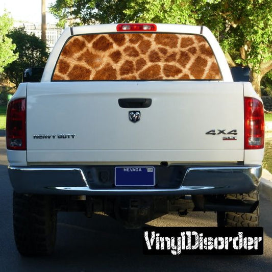 Giraffe animal print rear window graphic with brown and tan pattern on truck