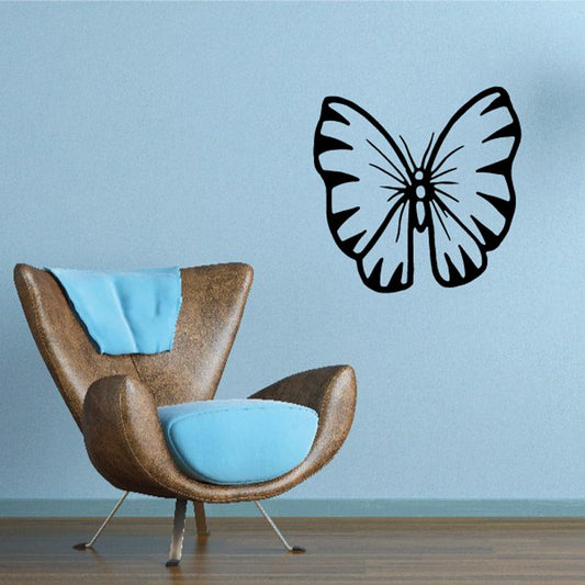 Butterfly wall decal with blue accents and black wings on light background
