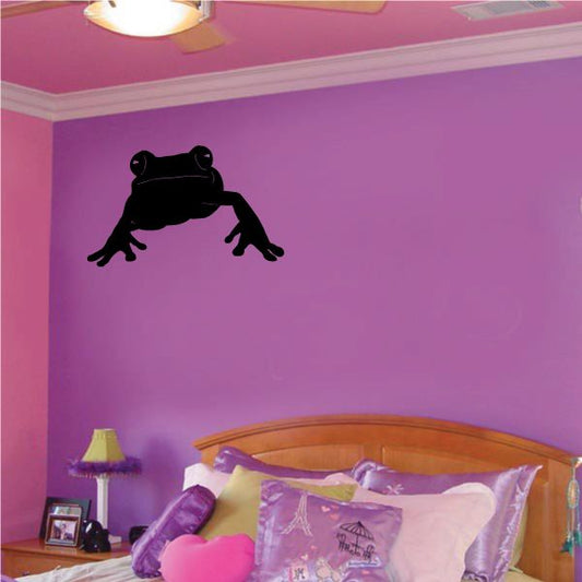 Black frog silhouette wall decal with open hands and crossed legs