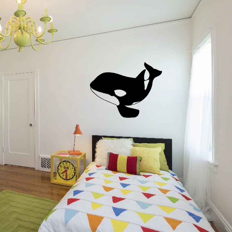 Black orca whale wall decal with stylized jumping silhouette