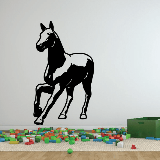 Approaching pony decal: black horse silhouette with white mane and legs