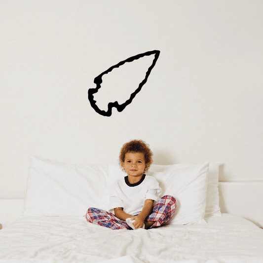 Right-pointing arrowhead decal with black outline