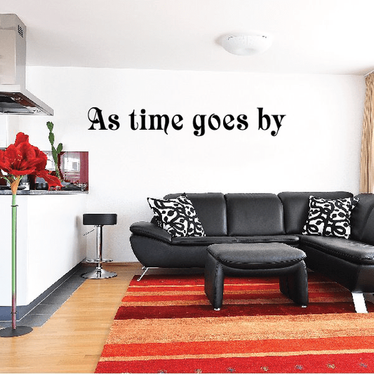 As time goes by wall decal with black cursive lettering on white wall