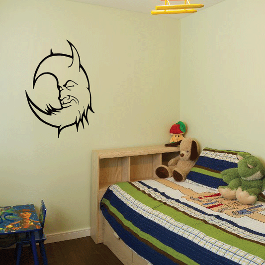 Asleep moon wall decal with black crescent outline and sleeping face