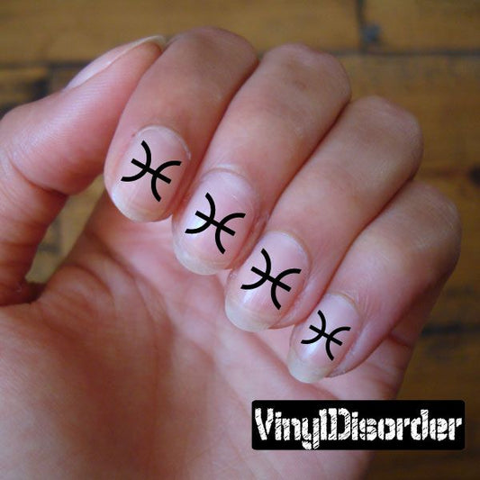 Fingernail art stickers with black Pisces symbols on white nail decals