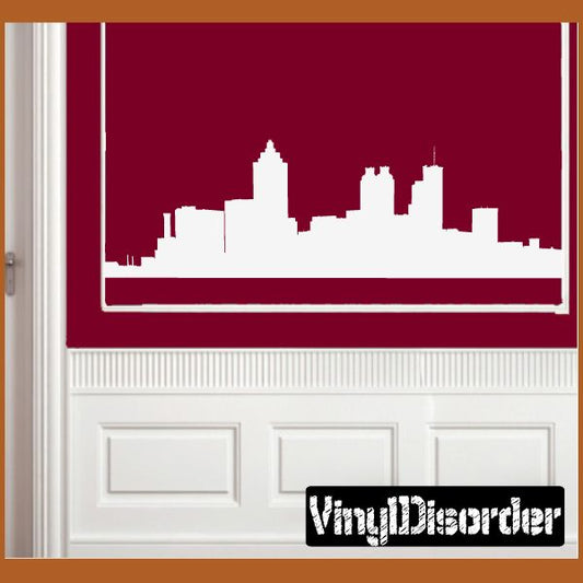Atlanta skyline wall decal with white city silhouette strip on maroon wall