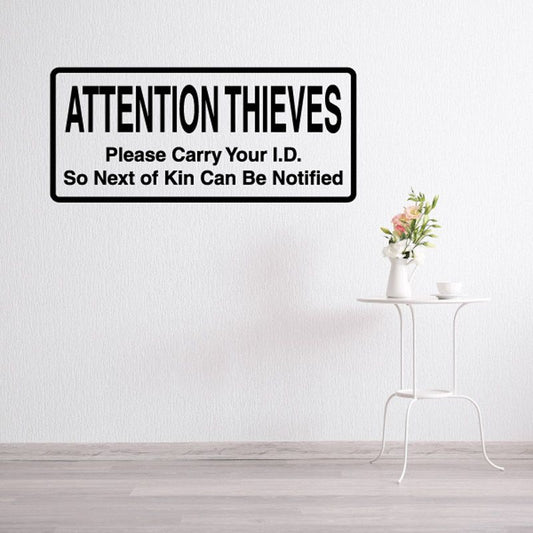 Attention Thieves ID carry notification decal, black text on white background
