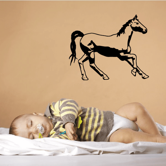 Black horse silhouette wall decal with lifted foreleg and detailed mane.