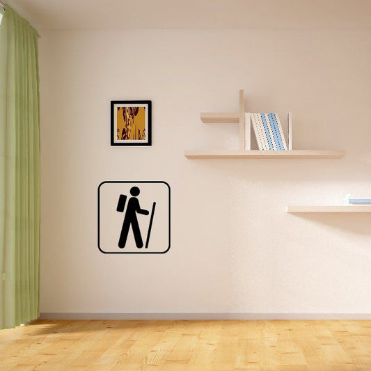 Backpacking hiker decal: black walking figure icon in white square border.
