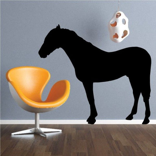 Black horse silhouette decal with a small spotted round accessory