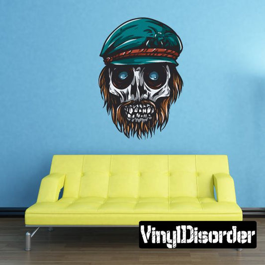 Bearded skull sticker with teal hat, blue eyes, and dark brown beard.