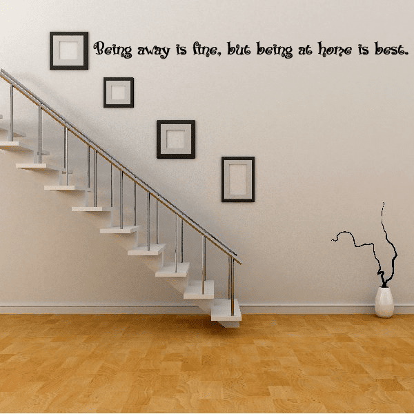 Wall decal with cursive text: “Being away is fine, but being at home is best”