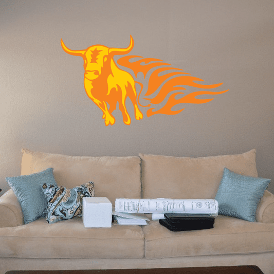 Orange bull head sticker with flaming tail on light wall