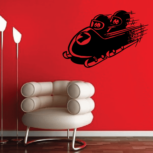 Black bobsled decal with racing track lines on a red surface